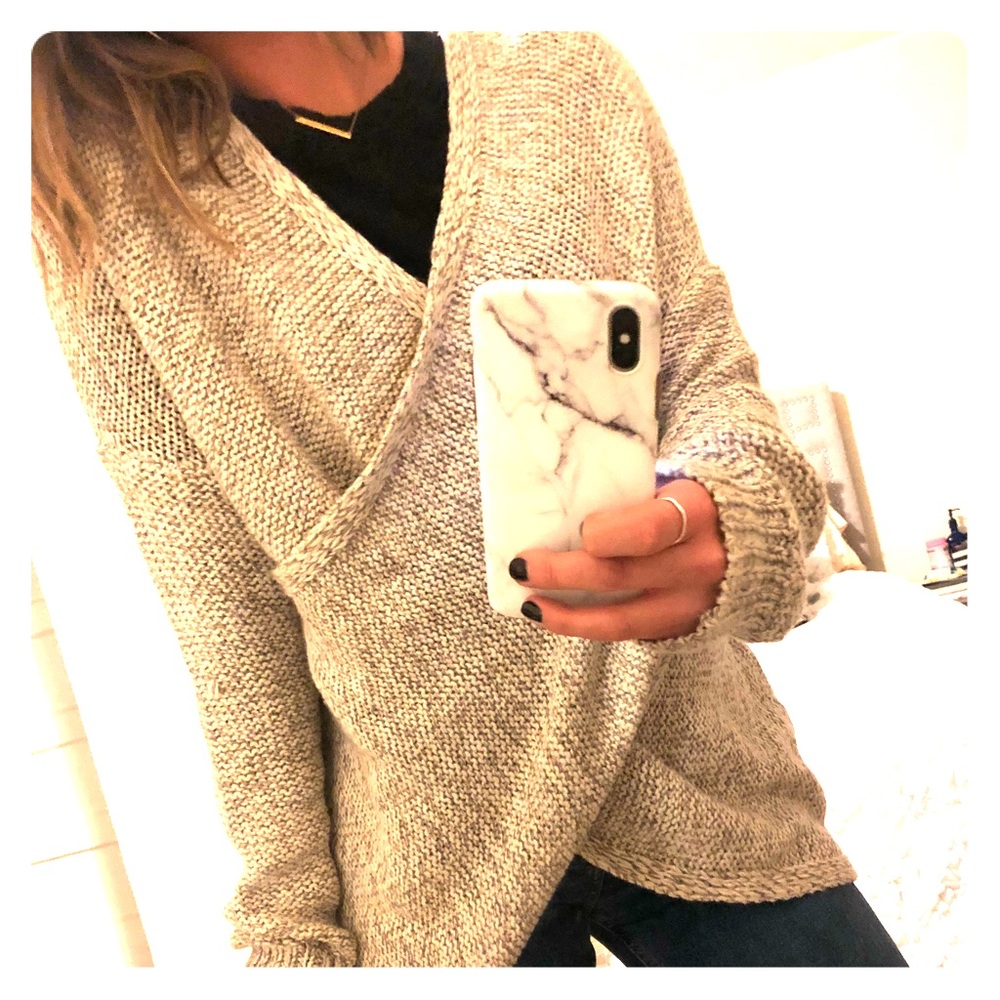 Knitted cross body sweater, worn twice.